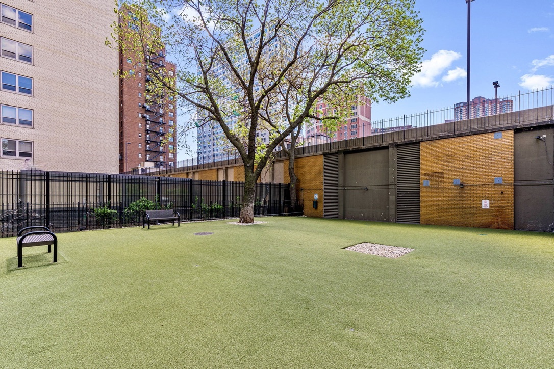 655 West Irving Park Road, Unit 4517 Chicago, IL 60613 - Photo 21 of 27 a backyard of a house with barbeque oven and outdoor seating