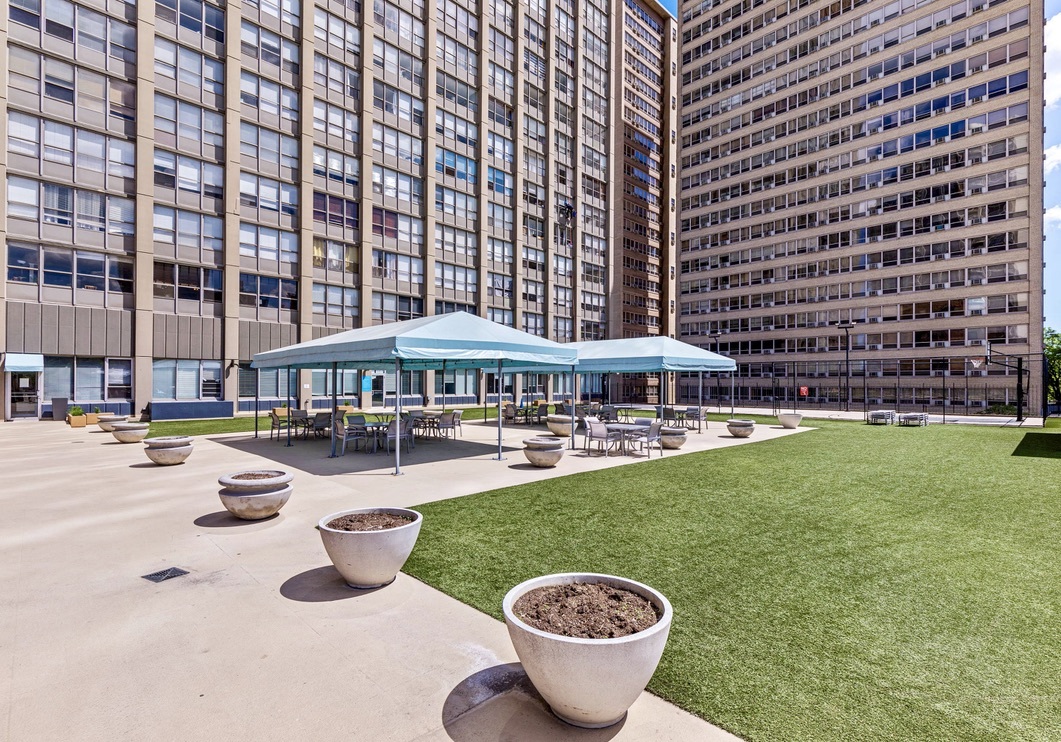 655 West Irving Park Road, Unit 4517 Chicago, IL 60613 - Photo 22 of 27 a view of a swimming pool and lounge chairs