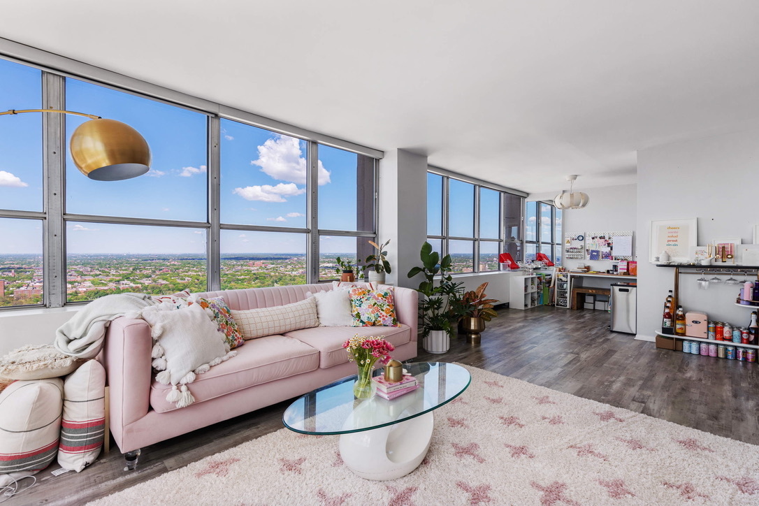 655 West Irving Park Road, Unit 4517 Chicago, IL 60613 - Photo 4 of 27 a living room with furniture and a large window