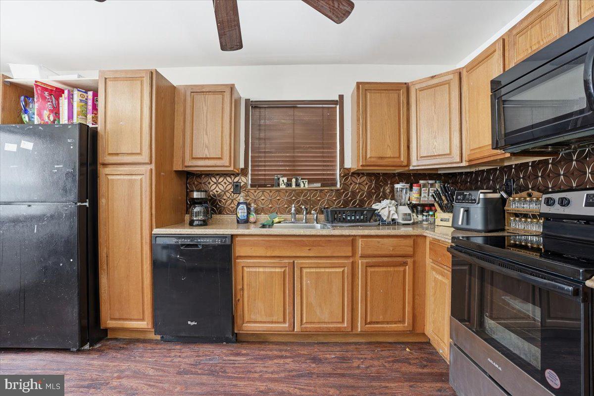 3301 Windemere Drive Bushkill, PA 18324 - Photo 14 of 70 a kitchen with stainless steel appliances granite countertop a refrigerator stove top oven a sink and dishwasher