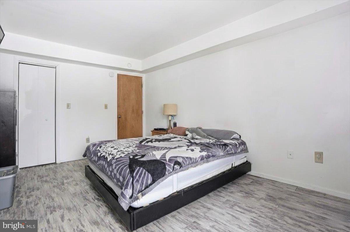 3301 Windemere Drive Bushkill, PA 18324 - Photo 20 of 70 a bedroom with a bed and wooden floor