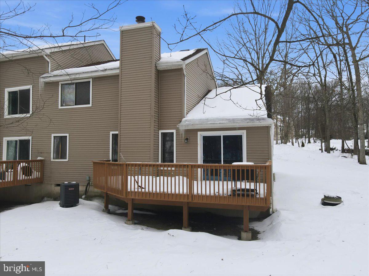 3301 Windemere Drive Bushkill, PA 18324 - Photo 40 of 70 a view of a house with a wooden deck and a roof deck