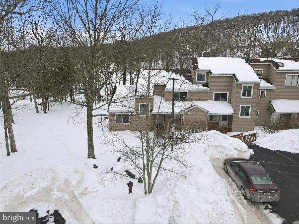 3301 Windemere Drive Bushkill, PA 18324 - Photo 58 of 70 a view of a terrace with chairs and a fire pit