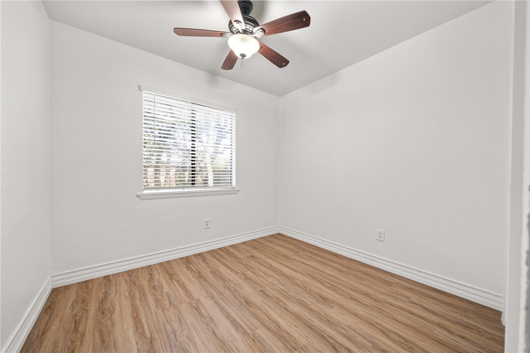 2551 Poinsetta Place Ingleside, TX 78362 - Photo 11 of 21 wooden floor in an empty room with a window