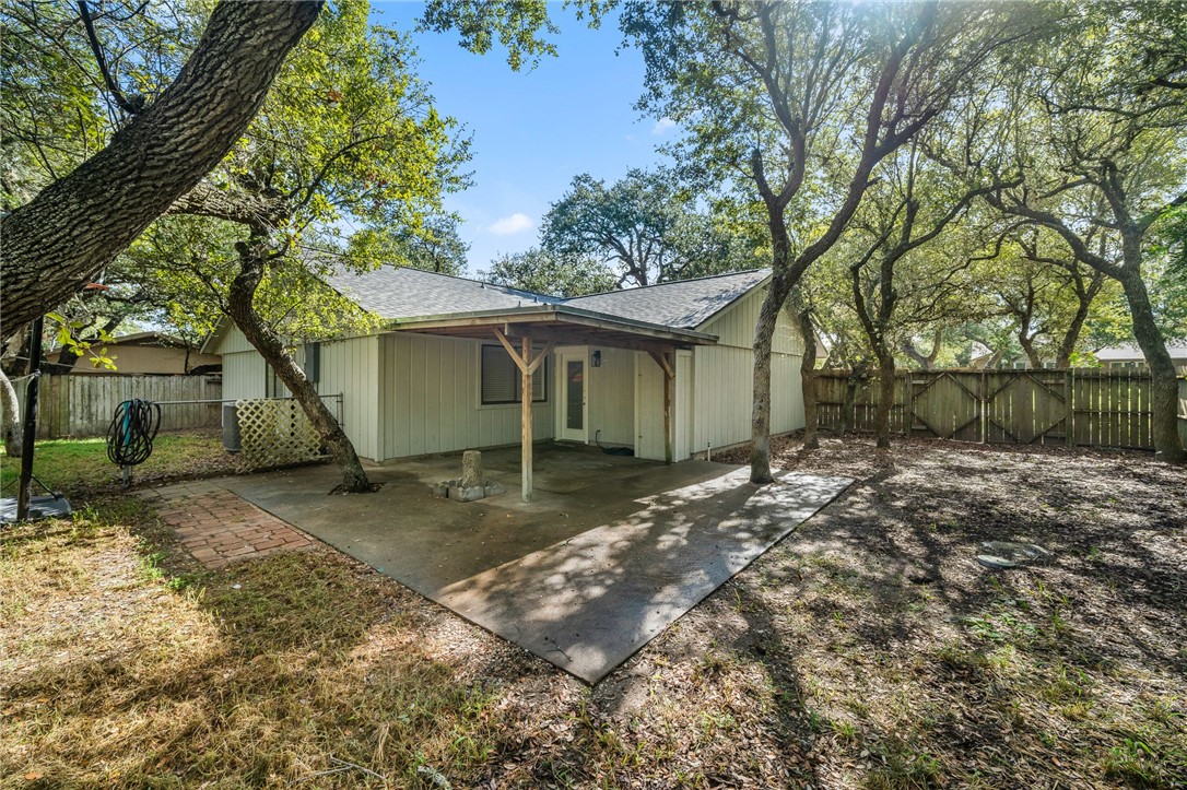 2551 Poinsetta Place Ingleside, TX 78362 - Photo 18 of 21 a view of a house with a yard and large tree