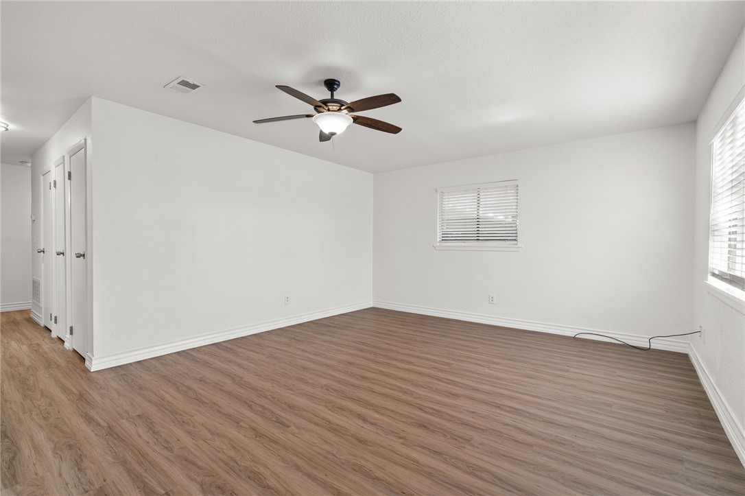 2551 Poinsetta Place Ingleside, TX 78362 - Photo 5 of 21 a view of empty room with wooden floor and fan