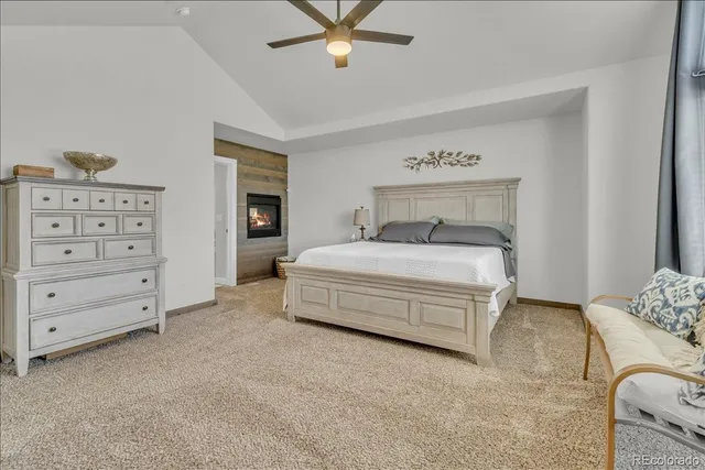 a spacious bedroom with a bed and window