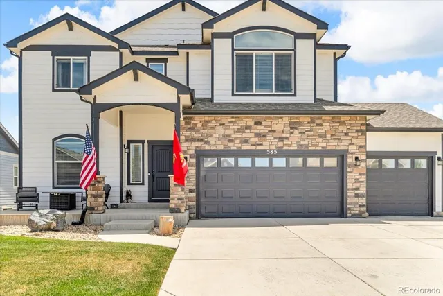 a front view of a house with garage