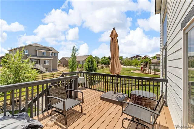 a view of a balcony with wooden floor