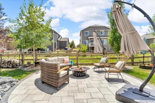 a view of a swimming pool with outdoor seating space