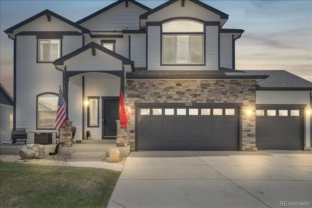 a front view of a house with garage