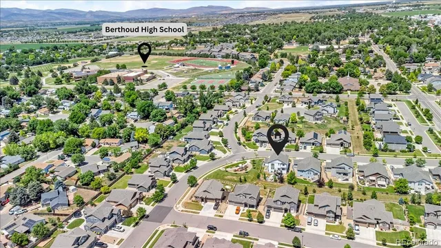 an aerial view of residential houses with outdoor space