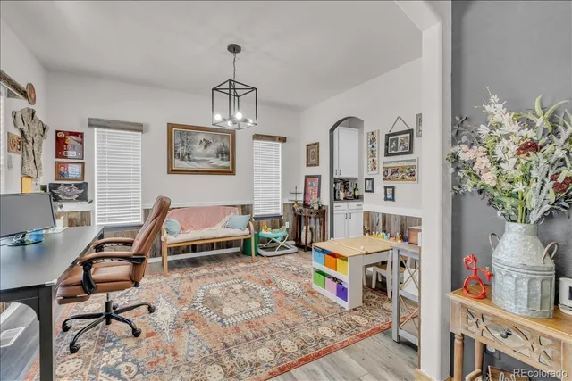 a bedroom with furniture and a chandelier