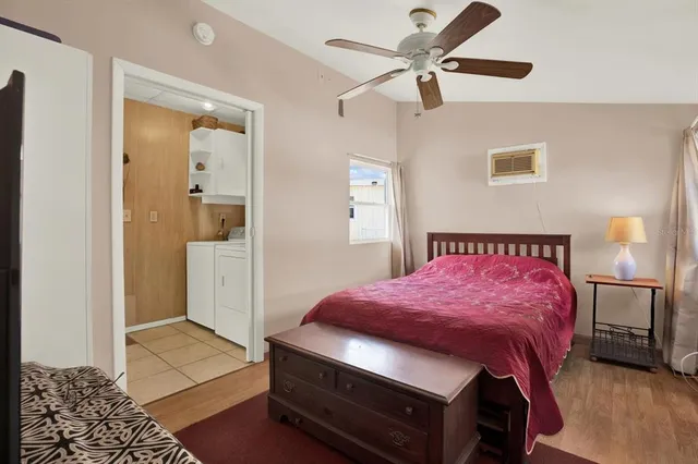 a bedroom with a bed and a view of bathroom