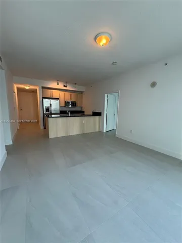 a view of a livingroom and a window