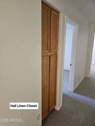 a view of a ceiling fan and a window