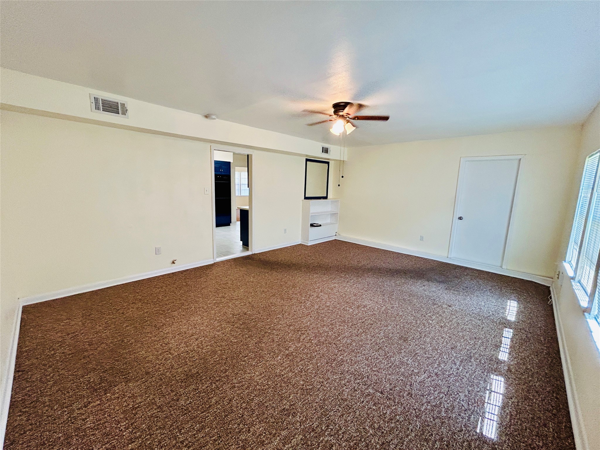 5806 Beldart Street Houston, TX 77033 - Photo 14 of 23 a view of a big room with carpet