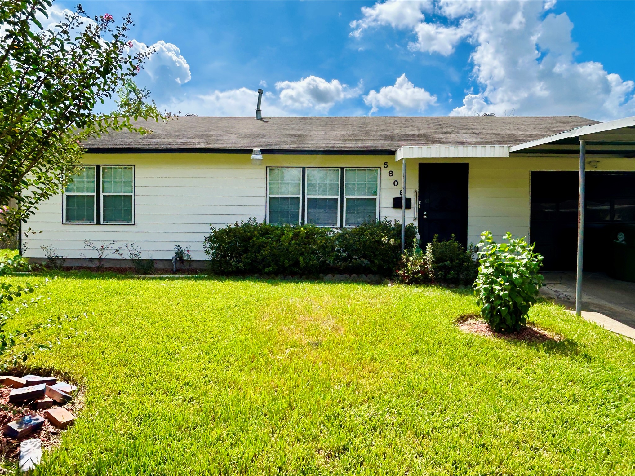 5806 Beldart Street Houston, TX 77033 - Photo 3 of 23 a view of a house with pool and garden