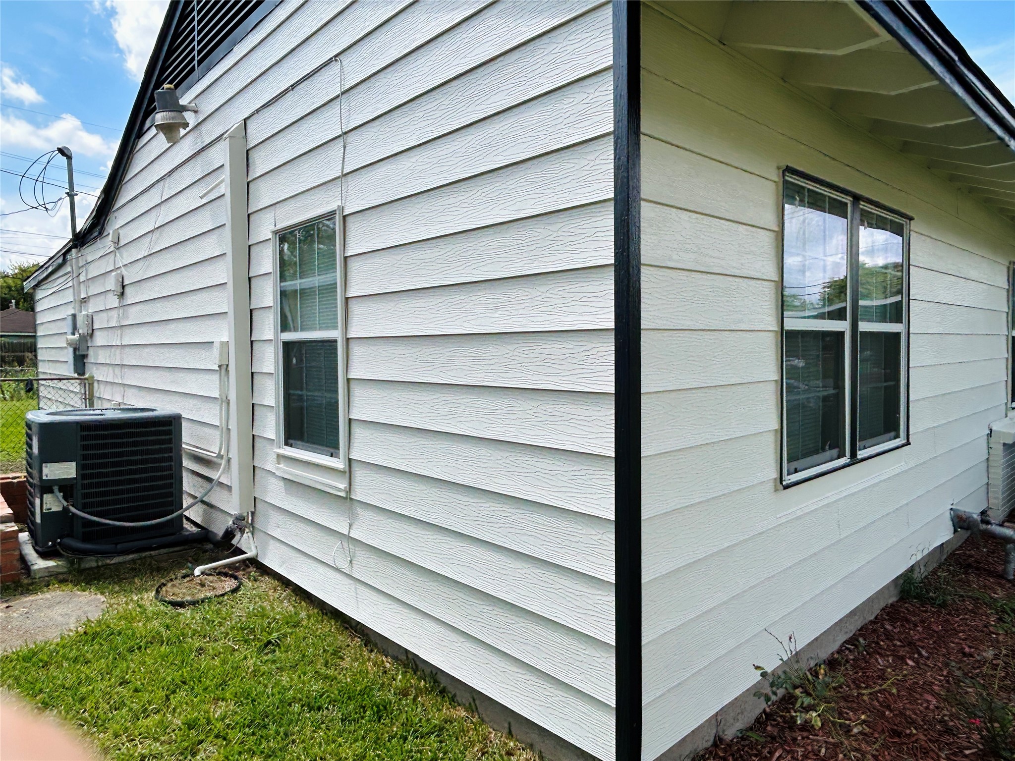 5806 Beldart Street Houston, TX 77033 - Photo 4 of 23 a view of a house with backyard and sitting area