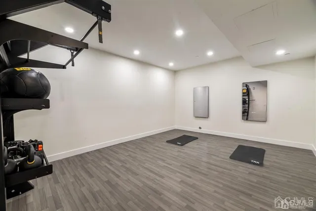a kitchen with a table chairs stove and cabinets