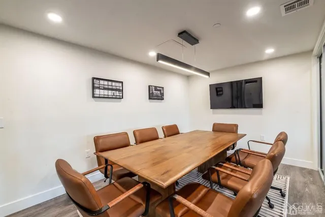 a view of a backyard with a table and chairs
