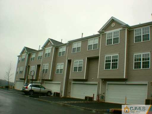 40 Rojewski Way Sayreville, NJ 08859 - Photo 2 of 2 a front view of a house with a yard