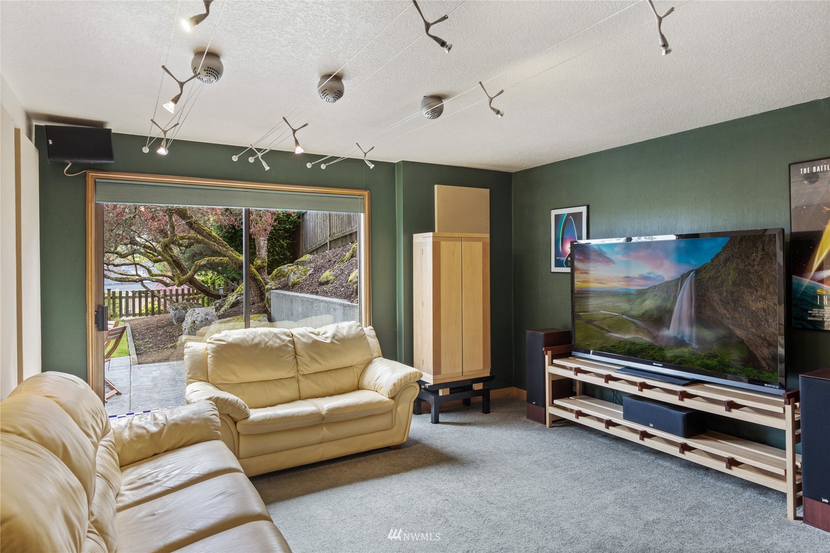 601 View Ridge Drive Everett, WA 98203 - Photo 26 of 38 a living room with furniture a flat screen tv and a floor to ceiling window