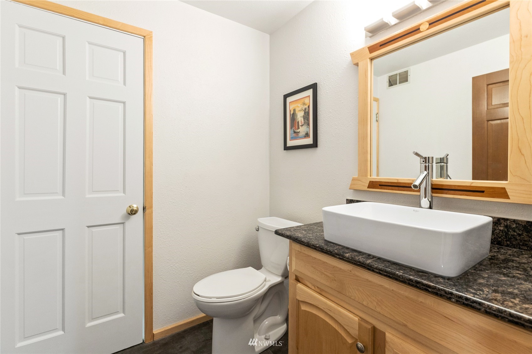 601 View Ridge Drive Everett, WA 98203 - Photo 30 of 38 a bathroom with a granite countertop toilet sink and mirror