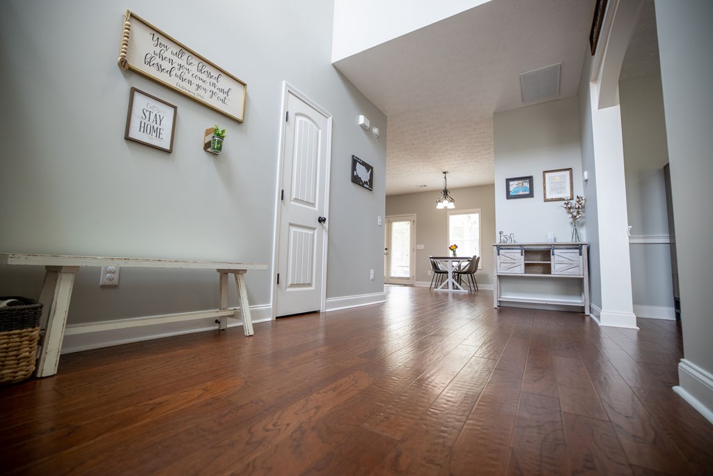 9660 Yellow Pine Road Midland, GA 31820 - Photo 4 of 27 a view of a living room filled with furniture and wooden floor