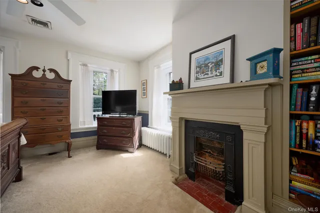 a bathroom with a toilet sink vanity and mirror