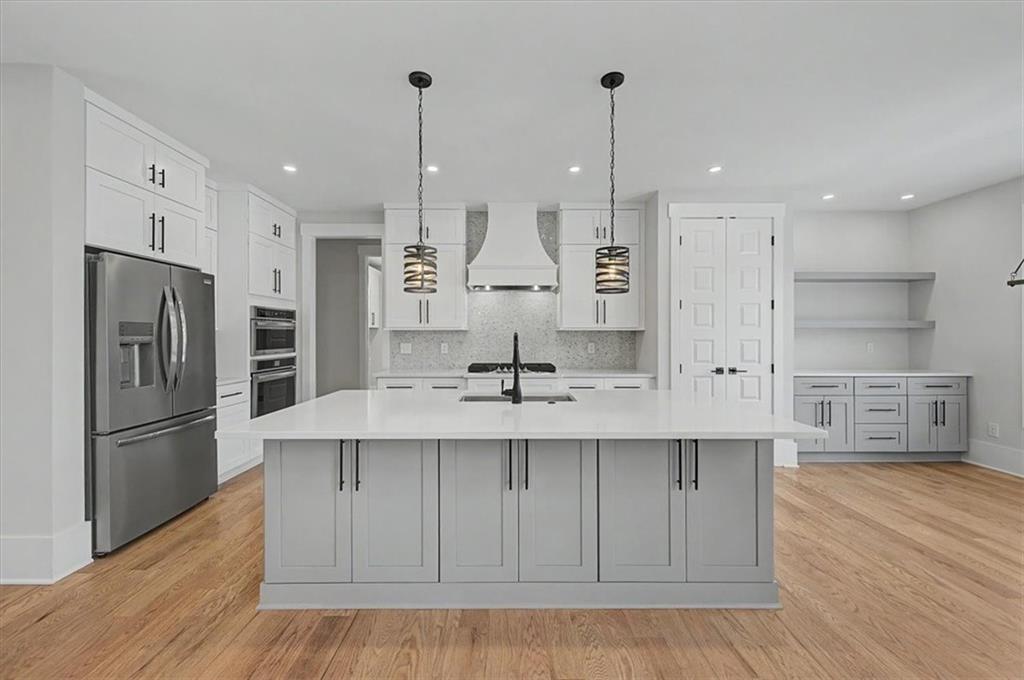 217 Laura Lake Road Marietta, GA 30066 - Photo 15 of 54 a kitchen with stainless steel appliances granite countertop a sink a refrigerator and a stove