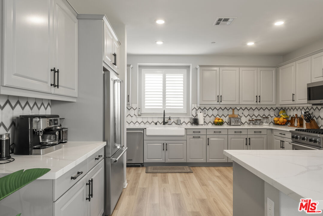 756 Daniel Freeman Circle Inglewood, CA 90301 - Photo 11 of 54 a kitchen with sink cabinets and window