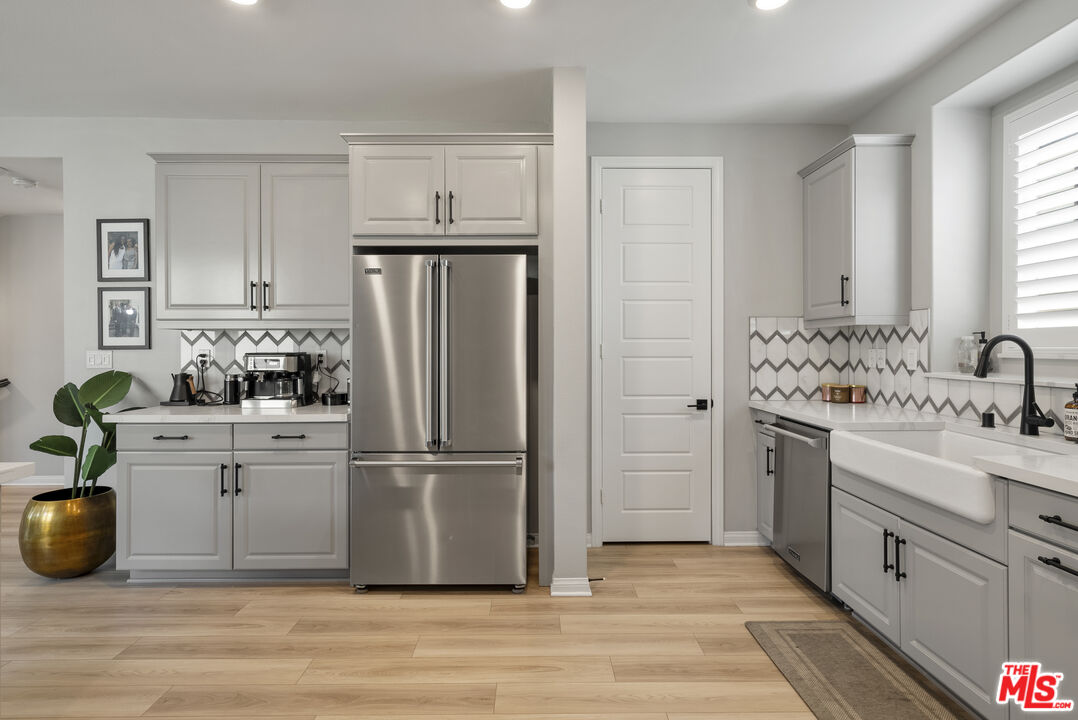 756 Daniel Freeman Circle Inglewood, CA 90301 - Photo 16 of 54 a kitchen with stainless steel appliances a refrigerator sink and cabinets
