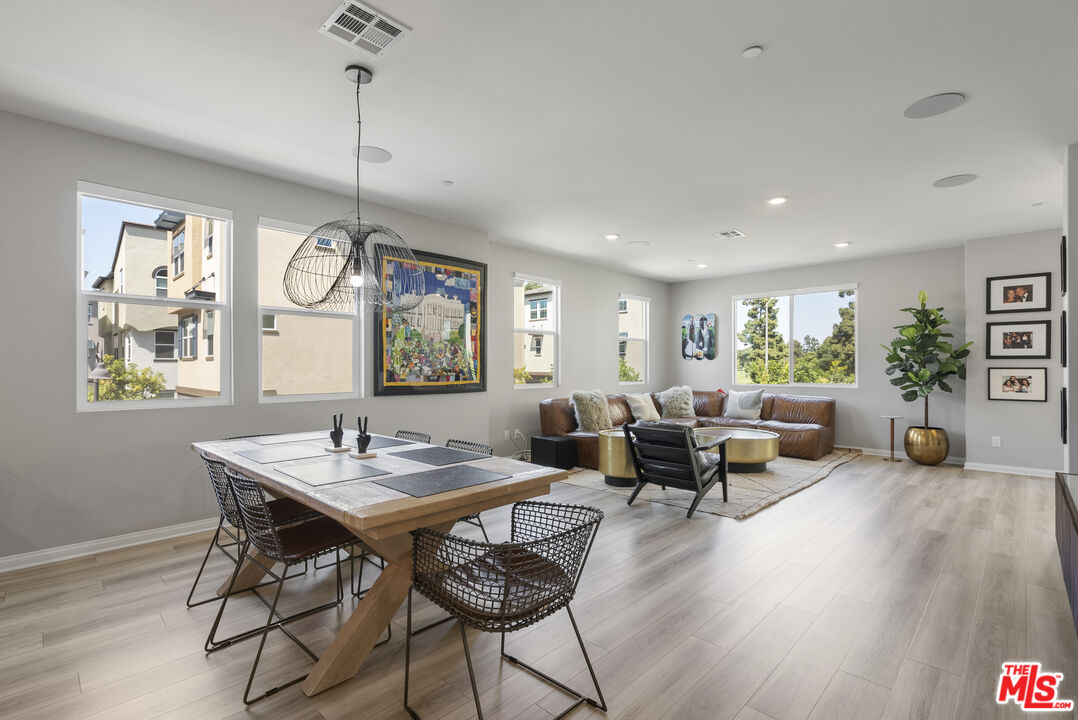 756 Daniel Freeman Circle Inglewood, CA 90301 - Photo 18 of 54 a living room with furniture two window and a wooden floor