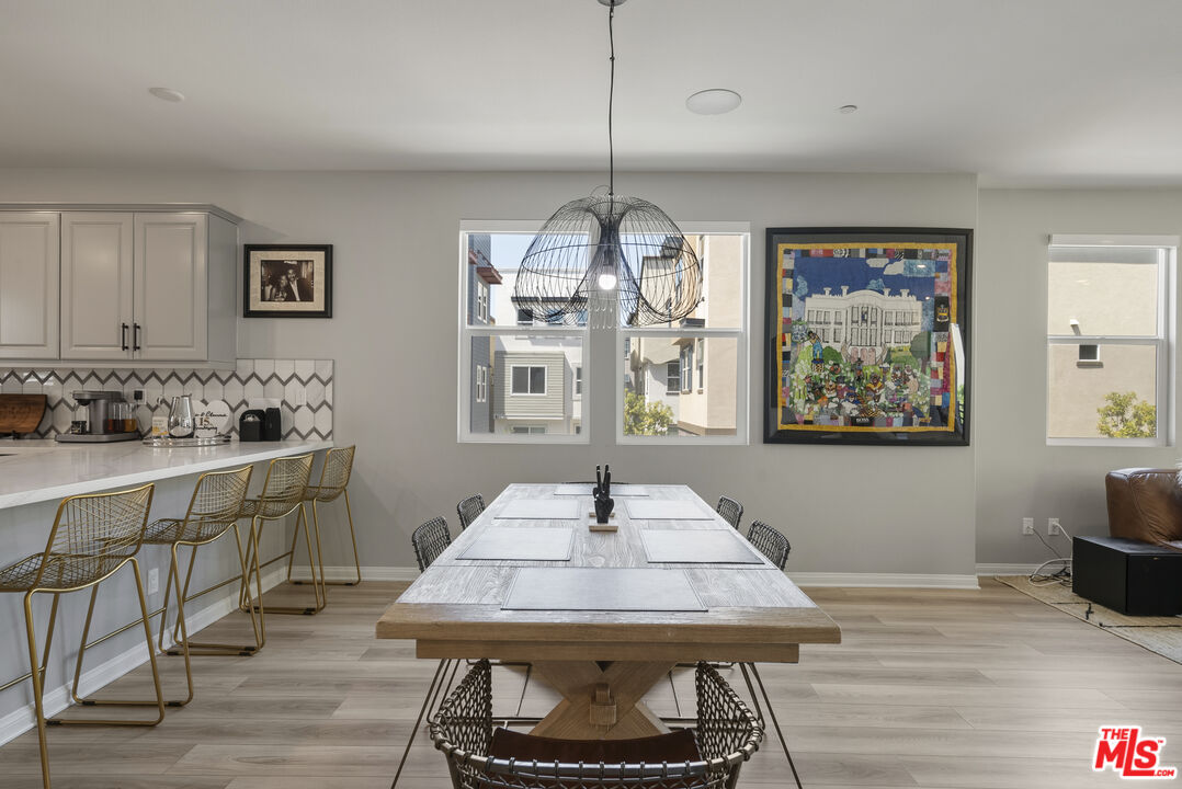 756 Daniel Freeman Circle Inglewood, CA 90301 - Photo 19 of 54 a view of a dining room with furniture window and wooden floor