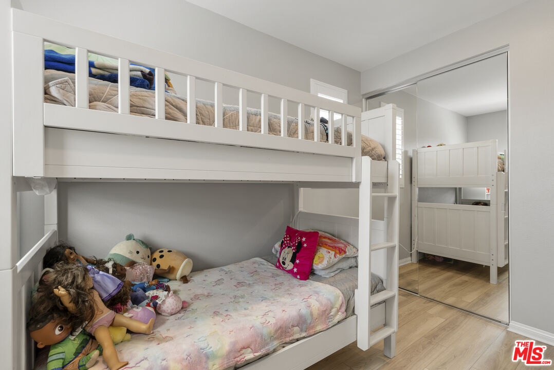 756 Daniel Freeman Circle Inglewood, CA 90301 - Photo 30 of 54 a bedroom with a bed and wooden floor