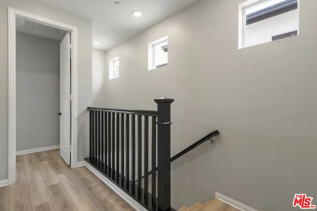 a view of a hallway with entryway door