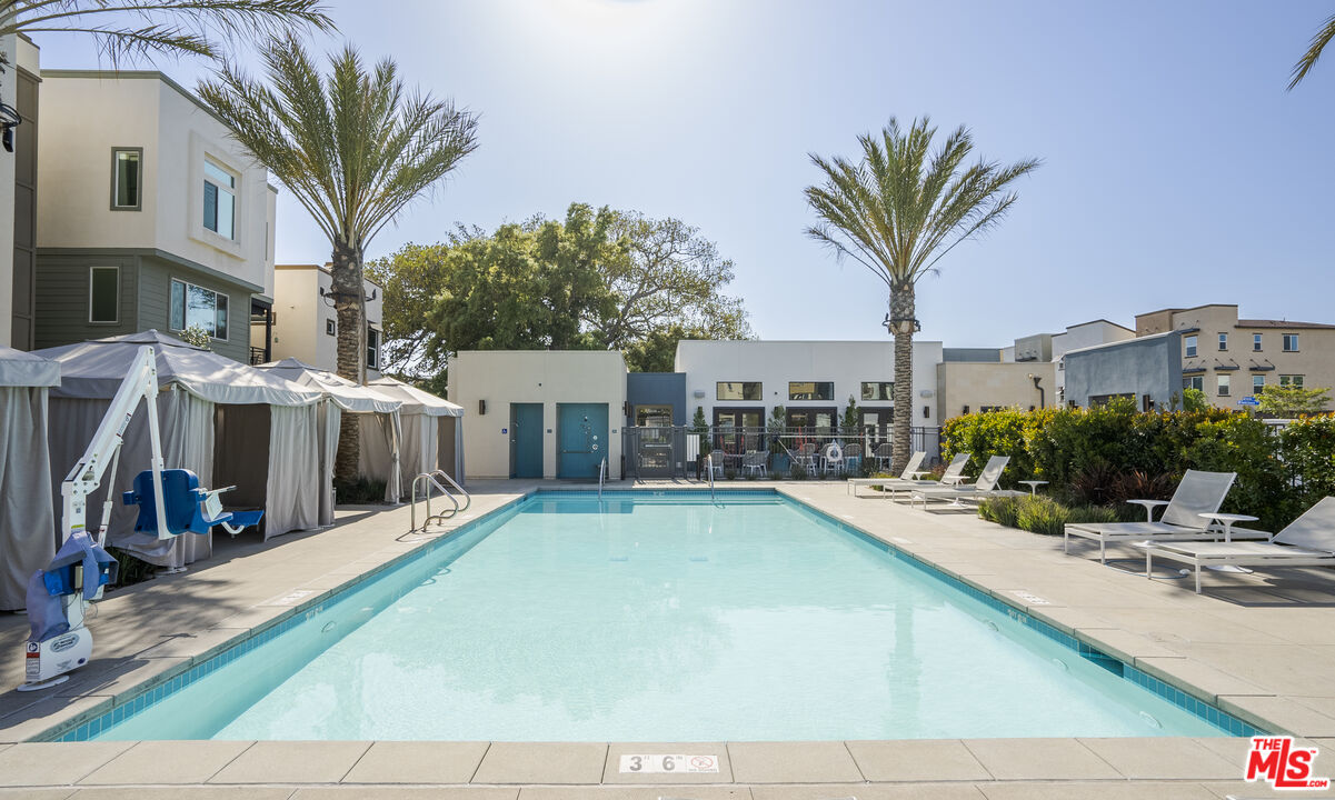 756 Daniel Freeman Circle Inglewood, CA 90301 - Photo 35 of 54 a view of a swimming pool with a lounge chairs