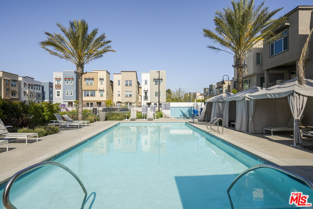 756 Daniel Freeman Circle Inglewood, CA 90301 - Photo 38 of 54 a view of a swimming pool with a lounge chairs