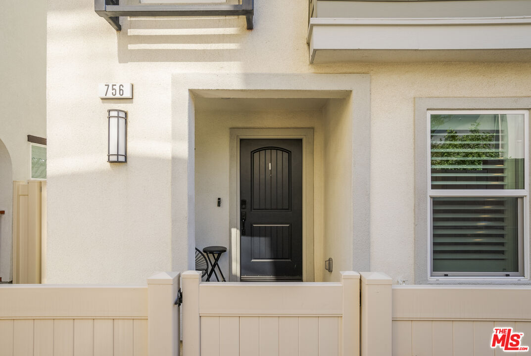 756 Daniel Freeman Circle Inglewood, CA 90301 - Photo 4 of 54 a living room with a bed and a dresser