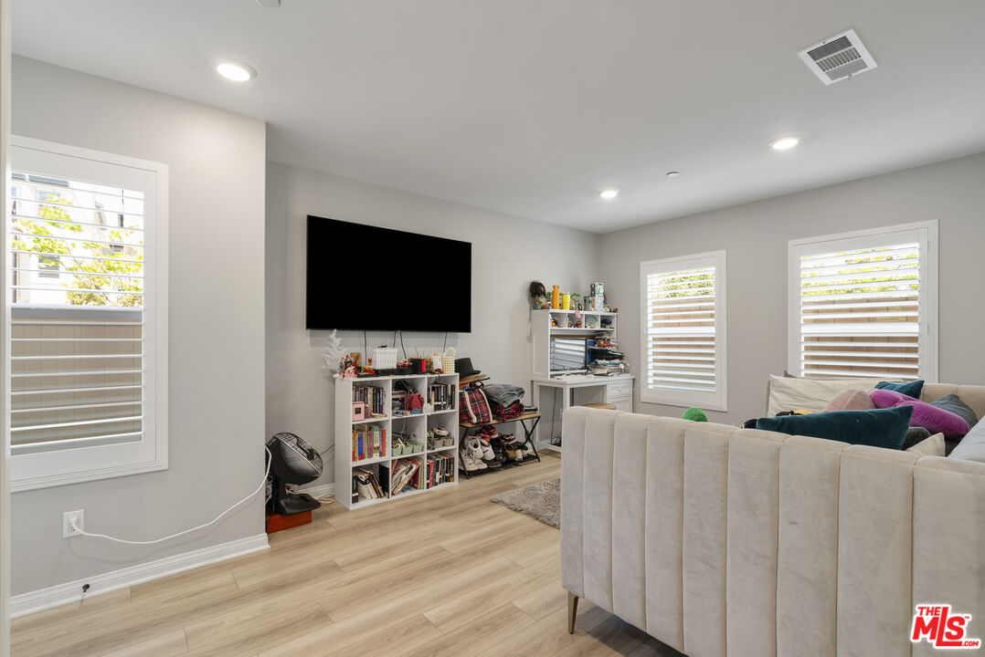 756 Daniel Freeman Circle Inglewood, CA 90301 - Photo 5 of 54 a living room with furniture and a flat screen tv