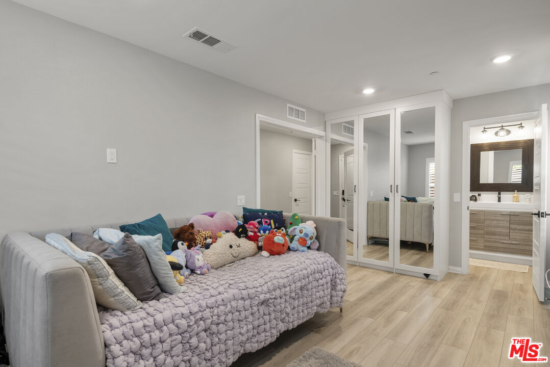 756 Daniel Freeman Circle Inglewood, CA 90301 - Photo 6 of 54 a bedroom with a bed and wooden floor