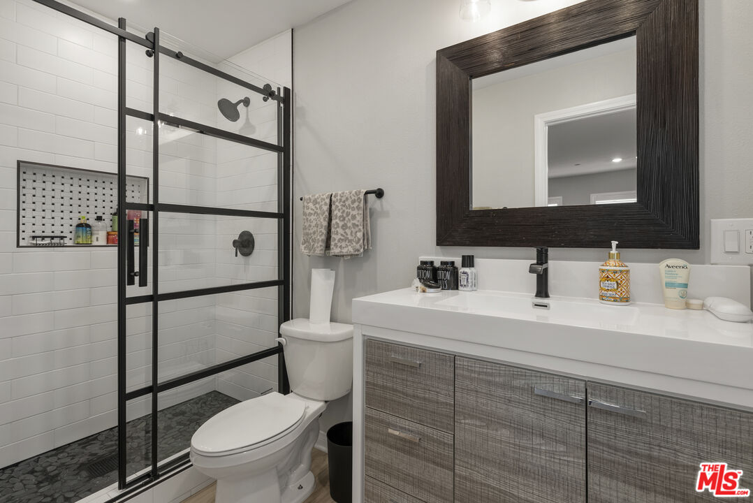 756 Daniel Freeman Circle Inglewood, CA 90301 - Photo 7 of 54 a bathroom with a toilet sink vanity granite and shower