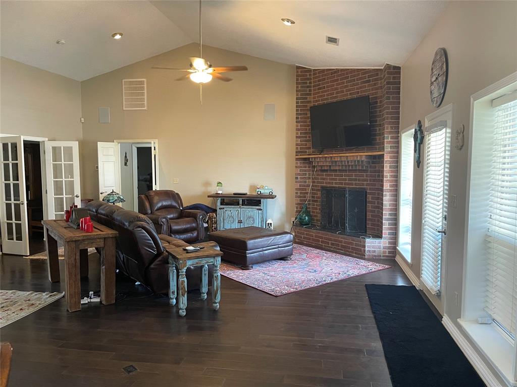 448 Audra Circle Rhome, TX 76078 - Photo 7 of 28 Wood burning fireplace to cozy up on those cold winter days