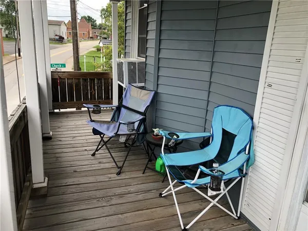 a patio with table and chairs