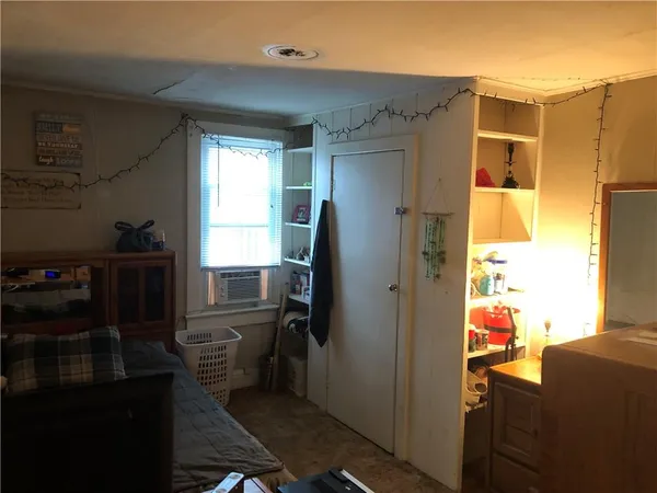 a kitchen with refrigerator and window