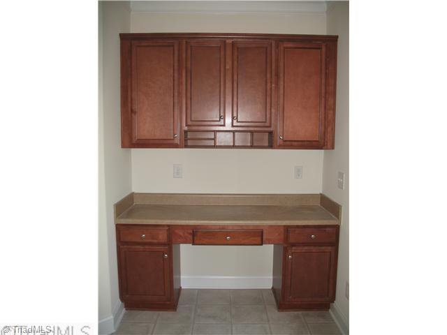 3768 Shadow Ridge Drive High Point, NC 27265 - Photo 3 of 10 Kitchen. Built-in Desk in Kitchen. Actual color of Cabinets for entire Kitchen