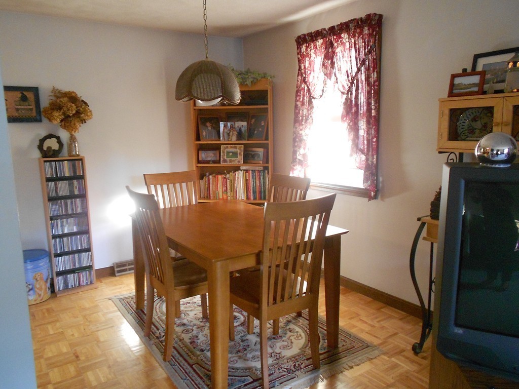 10 Virgo Lane Townsend, MA 01469 - Photo 6 of 14 a view of a dining room with furniture window and wooden floor
