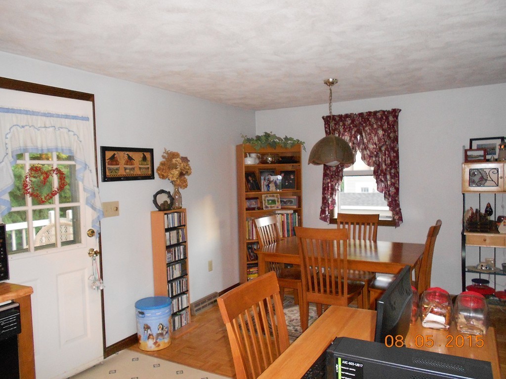 10 Virgo Lane Townsend, MA 01469 - Photo 7 of 14 a living room with furniture a rug and a window
