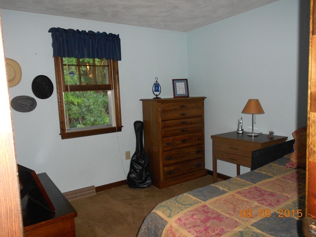 10 Virgo Lane Townsend, MA 01469 - Photo 9 of 14 a bedroom with a bed and a window